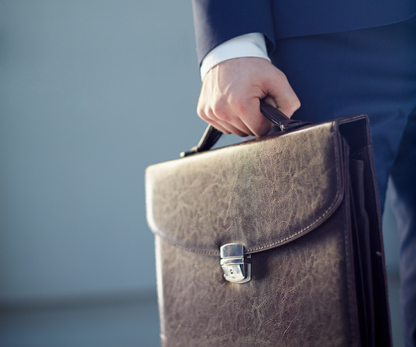 close-up-businessman-holding-briefcase